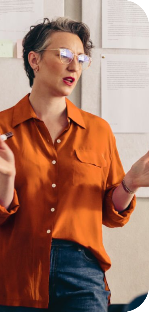 Woman gesturing near whiteboard