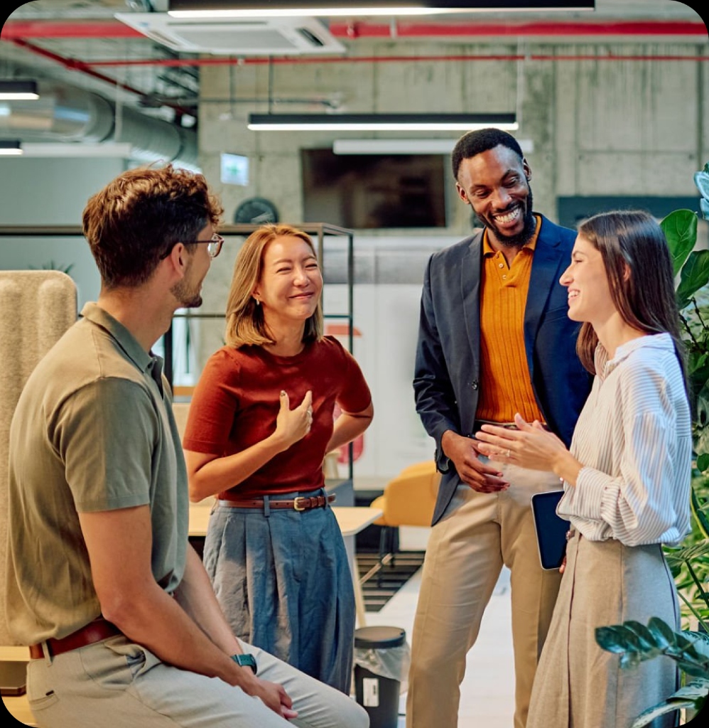 Four colleagues talking in office